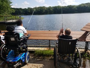 two friends fishing at the lake